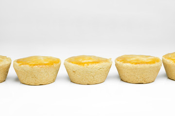 Traditional Brazilian mini chicken pies called empadas side by side in white background