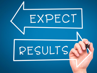 Man Hand writing Expect and Results with marker on transparent wipe board
