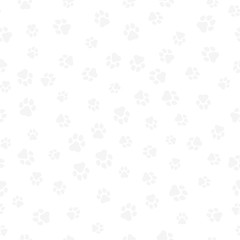 A pattern of canine tracks of different sizes. Traces of a light gray dog on a white background. Vector illustration in a flat style