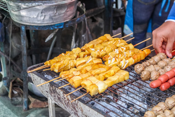 Delicious spicy grilled squid meat on sticks, Thai food