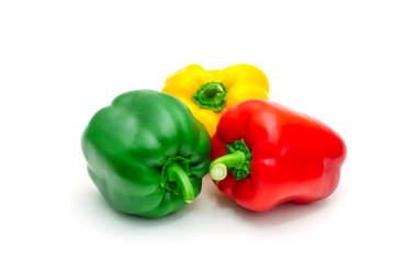 Green, yellow and red fresh bell pepper or capsicum isolated on white background.