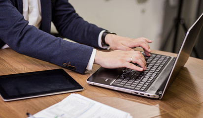 Businessman Working Laptop Connecting Networking Concept,Businessman working with documents on office desk.Business concept.Close up