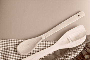 Top view of wooden spoons, sepia tone from above, copy space