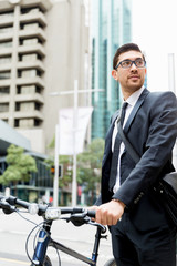 Young businessmen with a bike