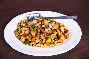 Plates of Asian food - chicken with vegetables, Myanmar