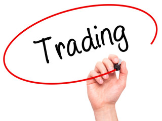 Man Hand writing Trading  with black marker on visual screen