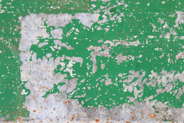 The flaking green color with scratched on the surface of rusty galvanized iron plate may be used as background 
