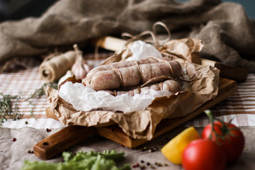 Composition with different spices and mortar on dark wooden background.