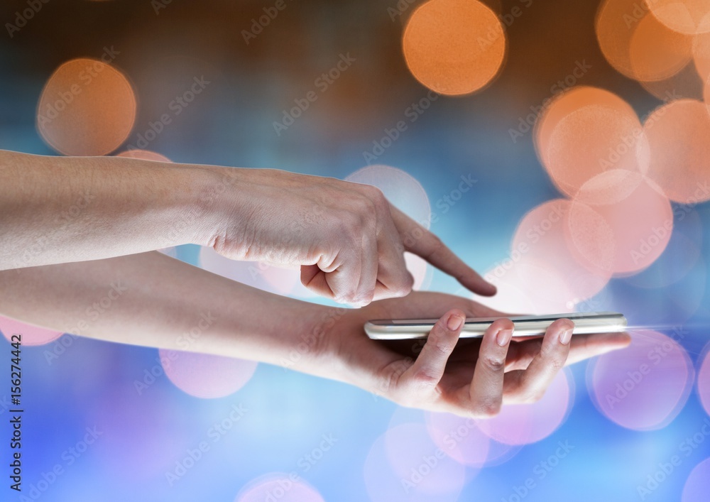 Poster hands with mobile phone with sparkling light bokeh background