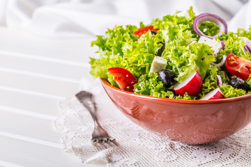 Salad. Vegetable salad. Spring vegetable salad.Fresh vegetable salad with tomatoes onion cheese and olives.