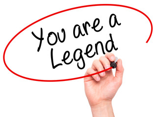 Man Hand writing You are a Legend   with black marker on visual screen