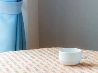 Coffee cup on the table in the morning, new start of the day