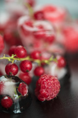 Frozen berries on wooden table