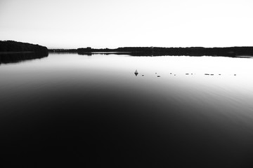 Abstract black and white still lake composition
