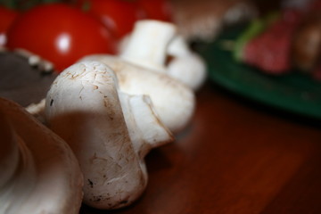 white mushrooms- background vegetables blurred
slow food