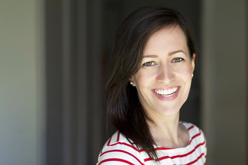 Portrait Of A Pretty Mature Woman Smiling At Home.