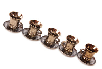 Ancient porcelain tea cups on a white background