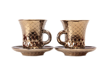 Ancient porcelain tea cups on a white background