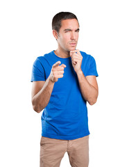 Suspicious young man against white background