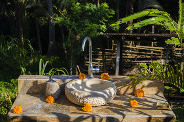 Water tap outdoor green park background in Ubud, island Bali, Indonesia