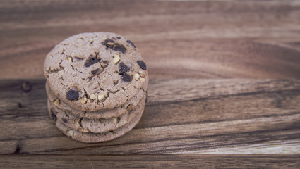 Fototapeta na wymiar chocolate chip cookies on a wooden table