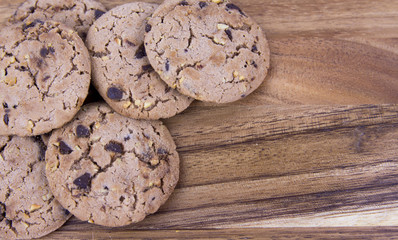 Close up chocolate chip cookies on wood table