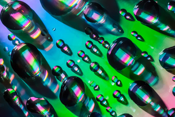Fototapeta na wymiar abstrack water drop on cd rainbow effect