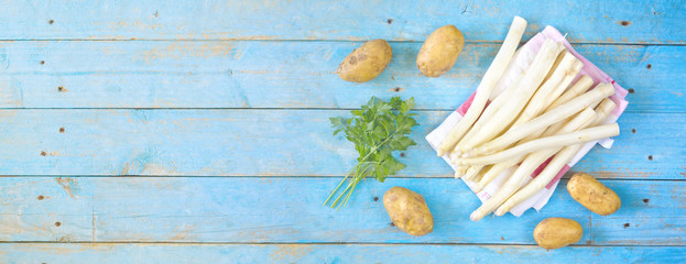 fresh asparagus, potatoes and parsley, flat lay , good copy space