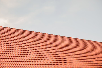 house roof tiles with clouds and sky