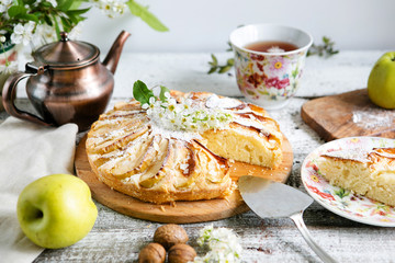 Cut apple pie, side view, rustic style
