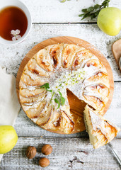 Home apple pie with bird cherry, vertical photo, top view