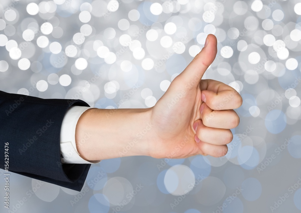 Poster hand thumbs up with sparkling light bokeh background
