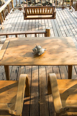 Wooden chair to sit and watch the beautiful sea.