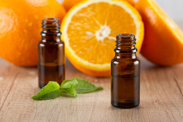 Orange essential oil and fresh orange