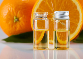 Orange aroma oil and fresh orange 