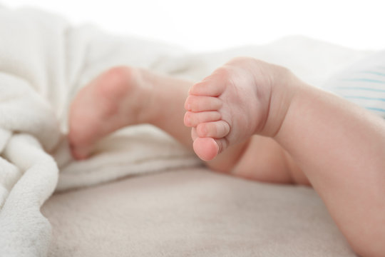 Adorable baby legs on light background
