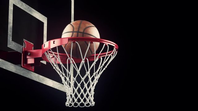 A throw basketball ball in a ring on a black background
