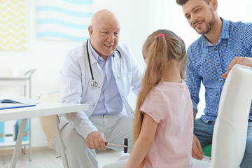 Fototapeta premium Little girl with father at neurologist's office