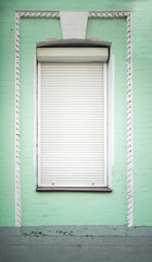 Vintage building with automatic blinds on window