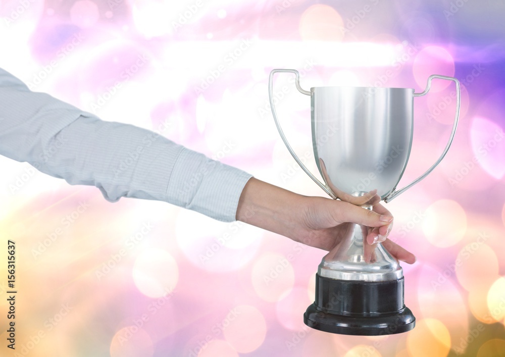 Poster hand with trophy and sparkling light bokeh background