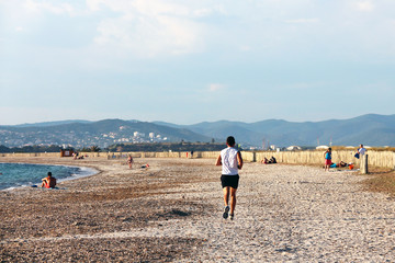 man running on the beach in Hyères - France