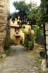 View of  ancient stone street  and home in Montefiroalle, Tuscany, Italy.