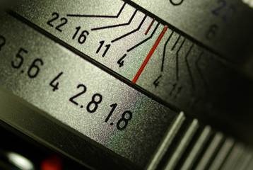 closeup of the marking of aperture on a metallic camera lens