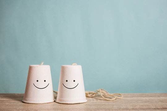 Classic Paper Cup Phone On Wood Background