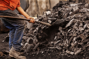 Coal worker working with a shovel
