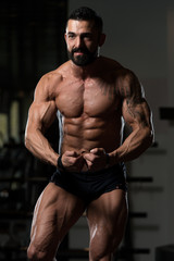 Man In Gym Showing His Well Trained Body