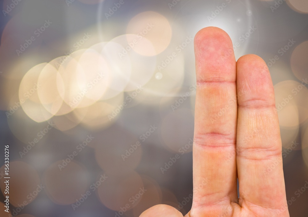 Poster two fingers with sparkling light bokeh background