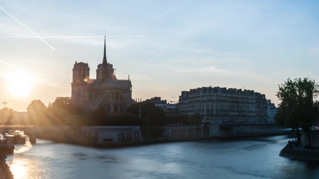 Timelapse Sunset with Notre-Dame Cathedral and the Seine river in Paris, France