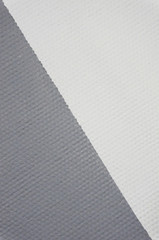 The wall is painted white and gray. Painting the walls. Repair of the apartment.