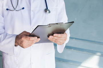 Doctor working near window in a hospital. 